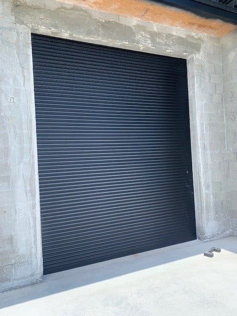 (2) New Alutech 10'x10' Motorized Roll Up Garage Doors/Hurricane Shutters
